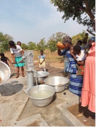 Community members using the new borehole
